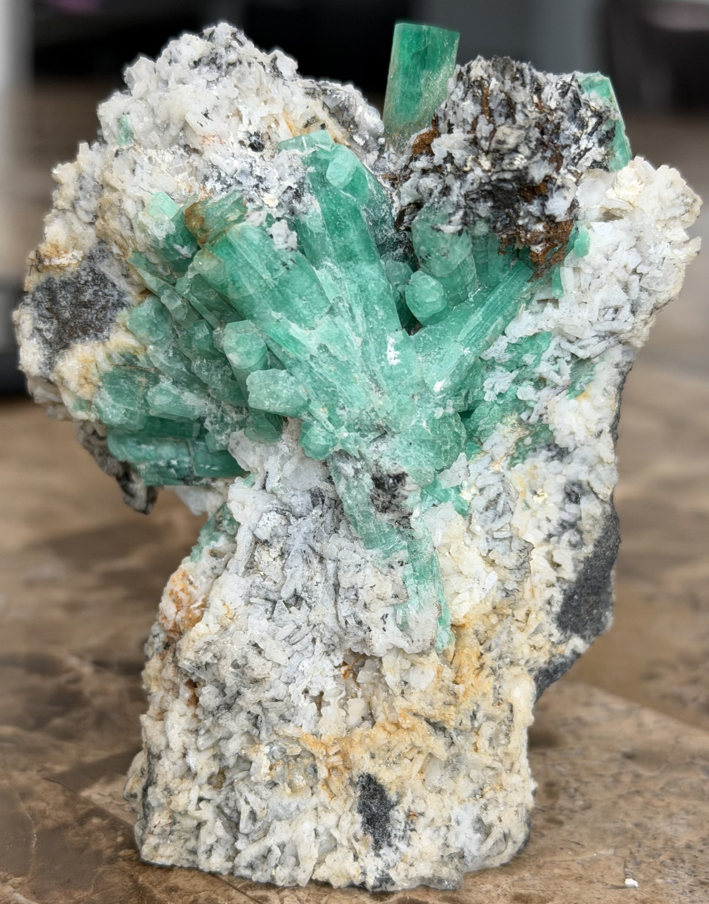 Natural emerald crystal in host matrix